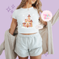 PRINTED GINGERBREAD CASTLE- EXCLUSIVE TO MoM - WOMENS CROPPED RIBBED BABY TEE