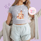 PRINTED GINGERBREAD CASTLE- EXCLUSIVE TO MoM - WOMENS CROPPED RIBBED BABY TEE