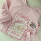 RTS SML WORLD COQUETTE - EXCLUSIVE TO MoM - PINK GILDAN SWEATSHIRT - SIZE M